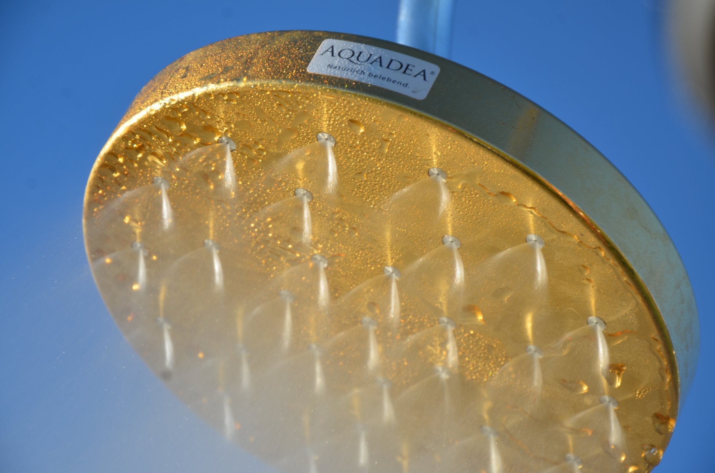 The Golden Shower Portal – gold-titanium commissioned installation by Aquadea
